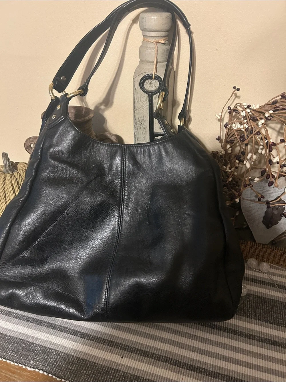 Coach Black Leather Shoulder Bag with Front Buckle Pocket and Gold Hardware